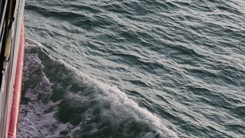 Full frame slow motion video of rough ocean surface with swirling whitewash Stock Footage 343820231