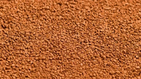Full frame slowly spinning background of freeze-dried instant coffee granules - Stock Footage 165452195