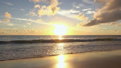 Full frame sunset sea beach sand clear cloud water wave blue sky background Stock Footage 153379443
