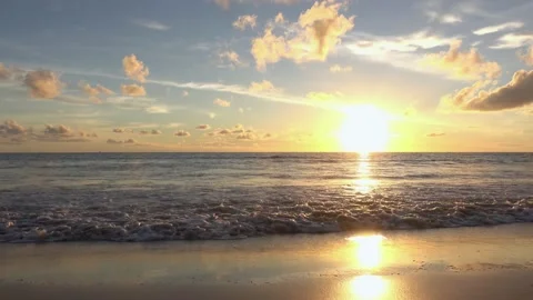 Full frame sunset sea beach sand clear cloud water wave blue sky background Video stock 153379564