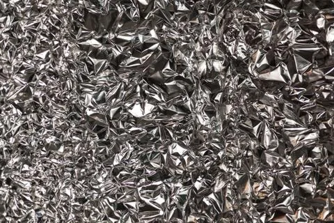 Full frame take of a sheeT of crumpled silver aluminum foil Stock Photos