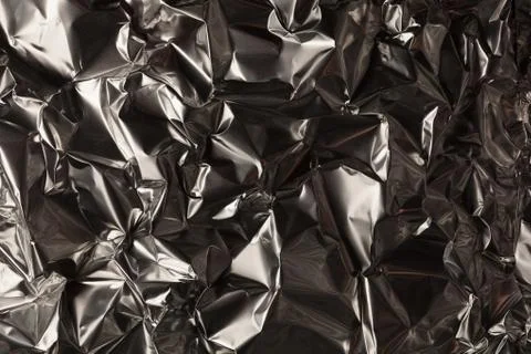 Full frame take of a sheeT of crumpled silver aluminum foil Fotos Stock