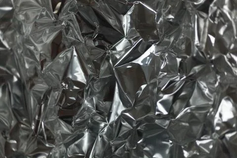 Full frame take of a sheeT of crumpled silver aluminum foil Foto stock