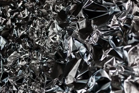 Full frame take of a sheeT of crumpled silver aluminum foil Foto stock