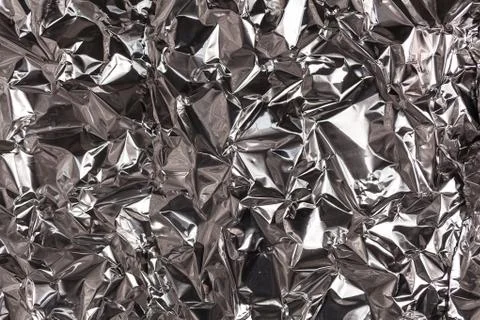 Full frame take of a sheeT of crumpled silver aluminum foil Foto stock