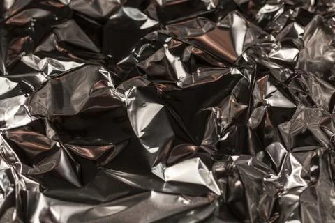 Full frame take of a sheeT of crumpled silver aluminum foil Stock Photos