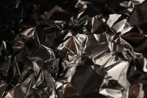 Full frame take of a sheeT of crumpled silver aluminum foil Foto stock
