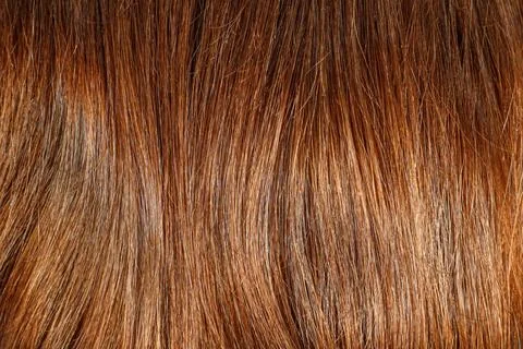 Full frame texture background of shiny healthy brown human hair Stock Photos