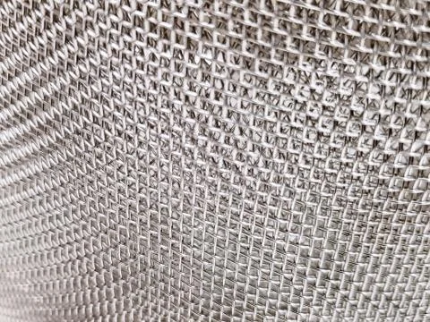 Full Frame Texture Background of Stainless Steel Mesh with Selective Focus Stock Photos