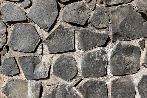 Full frame texture of cyclopean stone wall, rustic quarry stone masonry Stock-Fotos