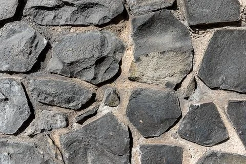 Full frame texture of cyclopean stone wall, rustic quarry stone masonry Stock-Fotos