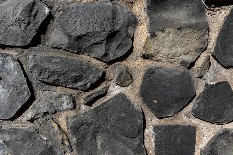 Full frame texture of cyclopean stone wall, rustic quarry stone masonry Stock-Fotos