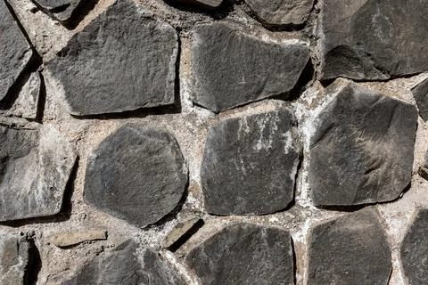 Full frame texture of cyclopean stone wall, rustic quarry stone masonry Stock-Fotos