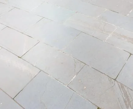 Full frame texture image of grey paving stones leading into the distance Stock Photos