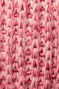 Full frame of the texture of knitted fabric made of wool thread. Stock Photos