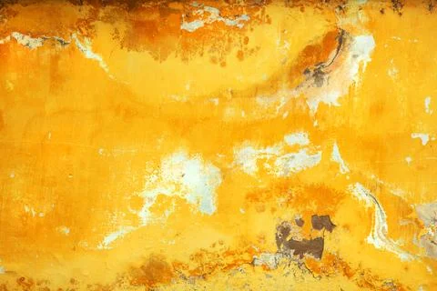 Full-frame texture of an old, weathered yellow concrete wall with peeling p.. Stock Photos