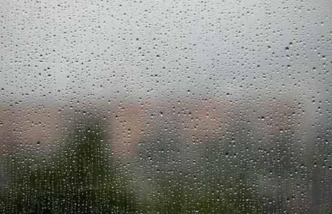 Full frame texture of rain drops on a window pane Stock Photos