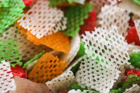 Full Frame Texture of Raw Colorful Lattice Tapioca Crackers, Uncooked Red G.. Stock Photos