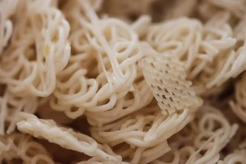 Full Frame Texture of Raw White Curly Tapioca Crackers, Uncooked Krupuk Maw.. Stock Photos
