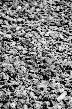 Full frame texture of small black volcanic pebbles and stones Foto stock
