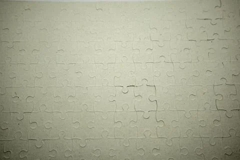 Full frame view of a blank, completed white jigsaw puzzle forming a seamles.. Foto stock