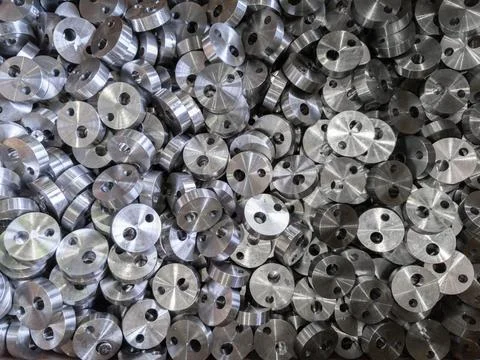 Full frame view on heap of round steel cylindrical parts after eccentric Stock Photos