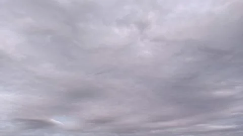 Full frame view of an overcast sky filled with textured grey and soft purple Photos