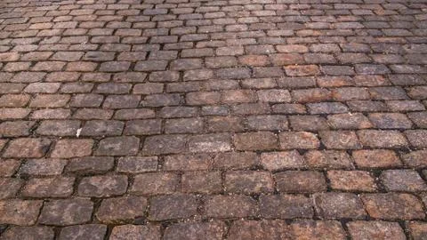 Full frame of warm tone cobblestone Street Stock Photos