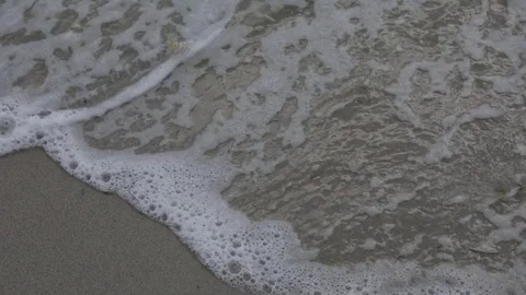 Full Frame Waves Lapping on the Sand Video stock 83977139