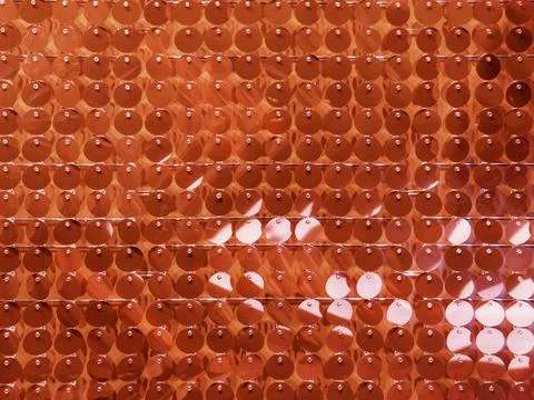 Full-framed background made of plastic spangles. Vibrant backdrop made of bri Stock Photos