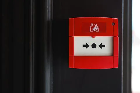 Full front view of outdoor wall mounted fire alarm button Stock Photos
