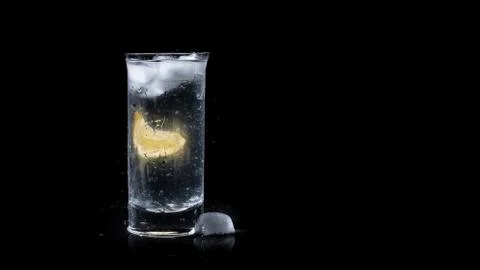 Full Glass Of Fresh Clean Water With A Lemon Isolated Black Background Stock Photos