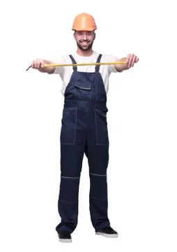 In full growth. man Builder with construction tape measure Stock Photos