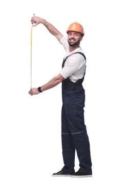 In full growth. man Builder with construction tape measure Foto stock