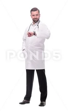 In full growth. medical doctor looking at his wrist watch Stock Photos