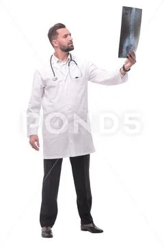 In full growth. medical doctor looking closely at the x-ray Stock Photos