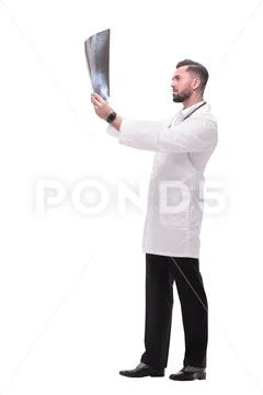 In full growth. medical doctor looking closely at the x-ray Stock Photos