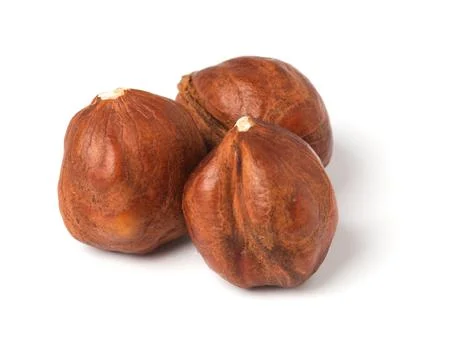 Full of hazelnuts on a white background. Isolated. Stock Photos