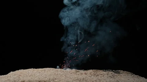 A full HD 1080p Slow motion video of a fuse wire being burnt under river sand Stock Footage 201491136