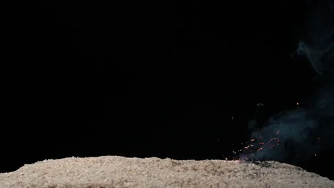 A full HD 1080p Slow motion video of a fuse wire being burnt under river sand Stock Footage 201491728