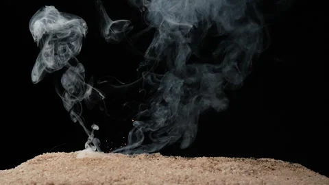 A full HD 1080p Slow motion video of a fuse wire being burnt under river sand Stock Footage 201492744