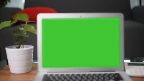 Full HD A laptop computer with a key green screen set on work office table. Stock Footage 105122652