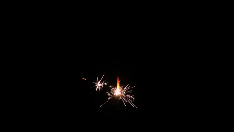 A Full HD Slow motion video of a sparkler burning and sparking isolated Stock Footage 201493126