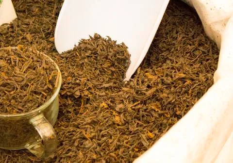 Full-leaf tea in a bag close-up Stock Photos