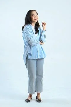 Full leght shoot of happy asian Indonesian woman wearing casual attire on i.. Stock Photos