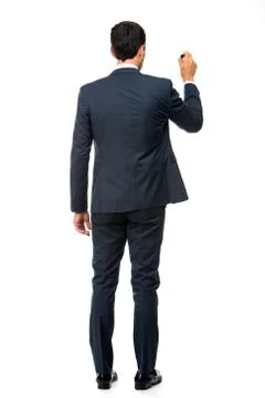 Full length back view portrait of a businessman with a black marker writing o Stock Photos