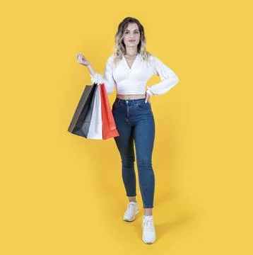 Full length body size view young attractive woman holding shopping bags Stock Photos