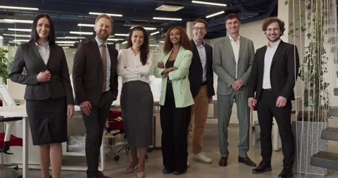 Full length corporate team portrait showing unity and leadership in bright Stock Footage 334775565