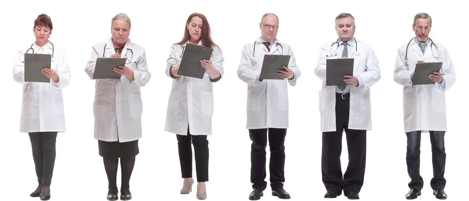 Full length group of doctors with notepad isolated Stock Photos