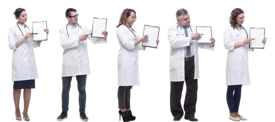 Full length group of doctors with notepad isolated Stock Photos